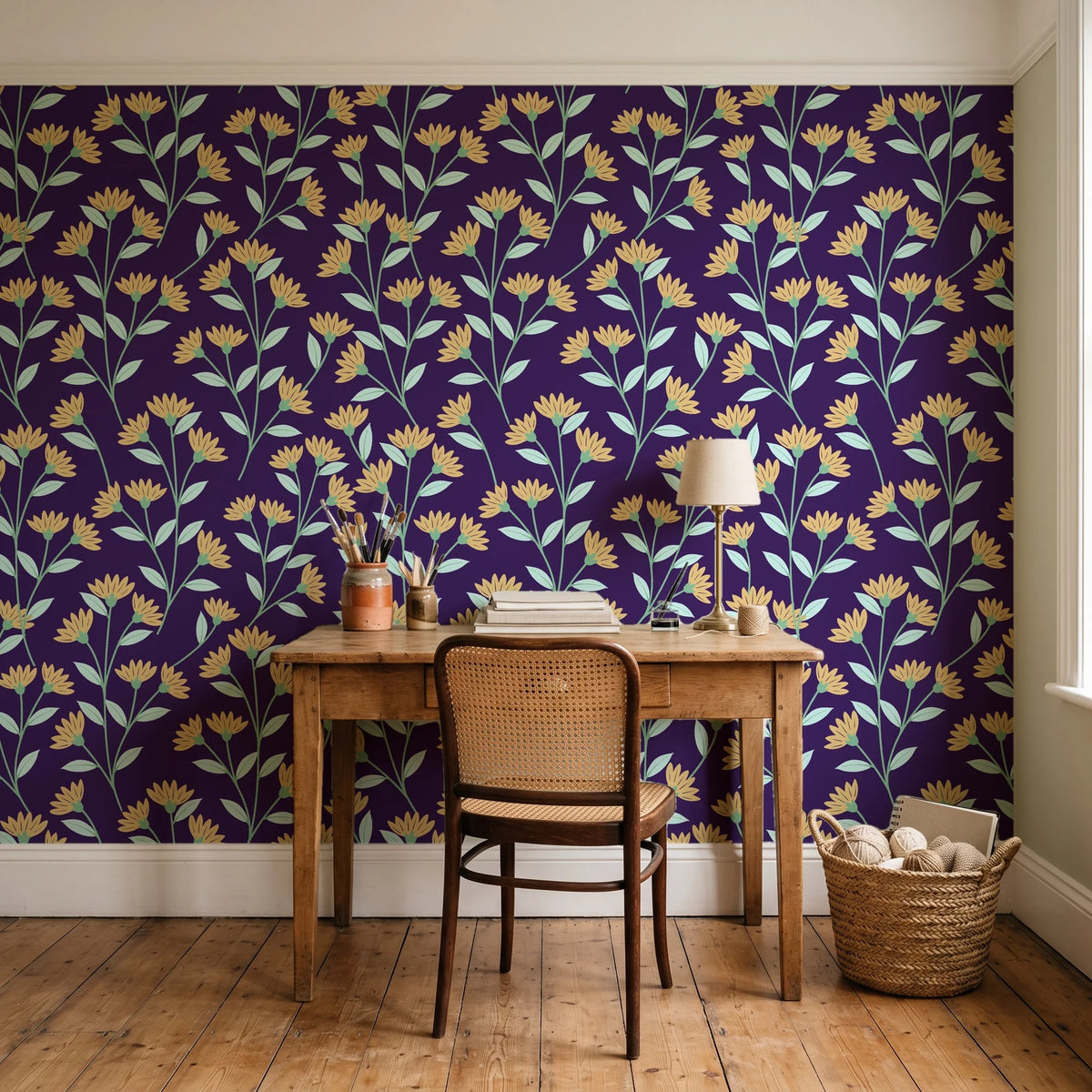 Evening Garden Plum botanical floral wallpaper behind a vintage writing desk in a cozy craft-room home office