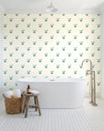 Falling Grace Emerald chevron wallpaper behind a freestanding tub in a bright coastal bathroom