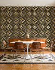 Fern Lattice Gilt hand-drawn diamond wallpaper in a mid-century dining room with a teak sideboard and tulip table