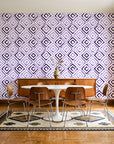 Fern Lattice Plum hand-drawn diamond wallpaper in a mid-century dining room with a teak sideboard and tulip table