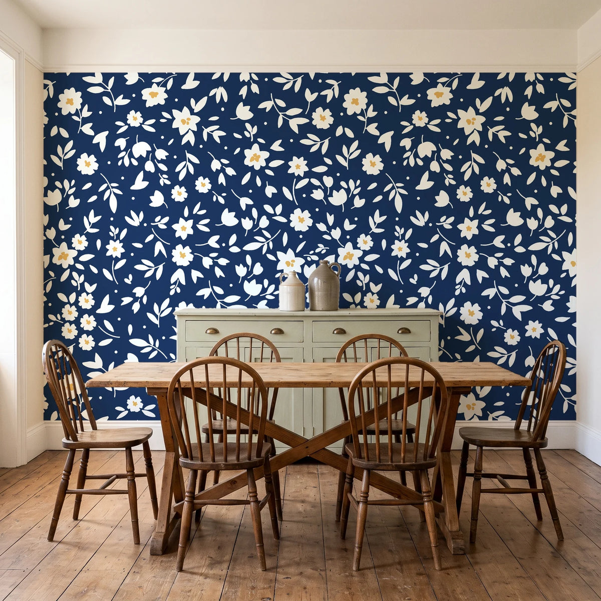 First Bloom Navy ditsy floral wallpaper in a farmhouse dining room with a sage sideboard and rustic trestle table
