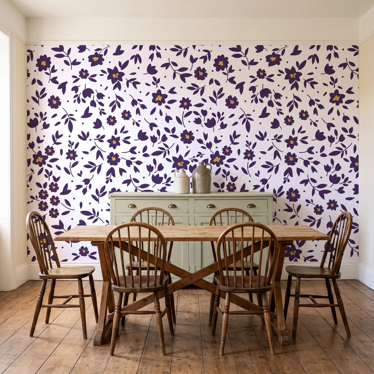 First Bloom Plum ditsy floral wallpaper in a farmhouse dining room with a sage sideboard and rustic trestle table