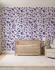 First Bloom Plum ditsy floral wallpaper in a calm, light-filled nursery