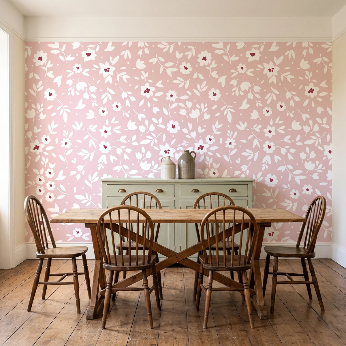 First Bloom Rose ditsy floral wallpaper in a farmhouse dining room with a sage sideboard and rustic trestle table