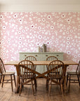 First Bloom Rose ditsy floral wallpaper in a farmhouse dining room with a sage sideboard and rustic trestle table