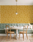 Forest Leaf Ochre botanical leaf wallpaper as a feature wall in a sunlit breakfast nook