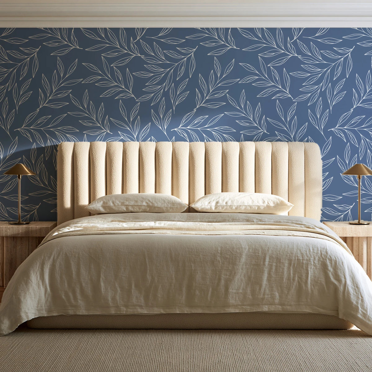 Forest Leaf Slate Blue botanical leaf wallpaper behind a channel-tufted bed in a calm primary bedroom