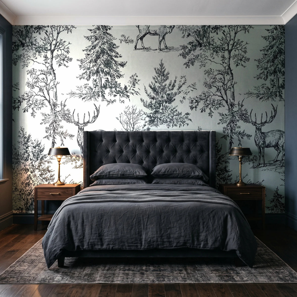 Frost & Fable Graphite woodland toile wallpaper behind a tufted headboard in a dark, moody bedroom