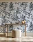 Frost & Fable Graphite woodland toile wallpaper on the wall of a grand entry foyer