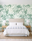 Frost Garden Veil Sage floral wallpaper behind a queen bed in a bright coastal bedroom