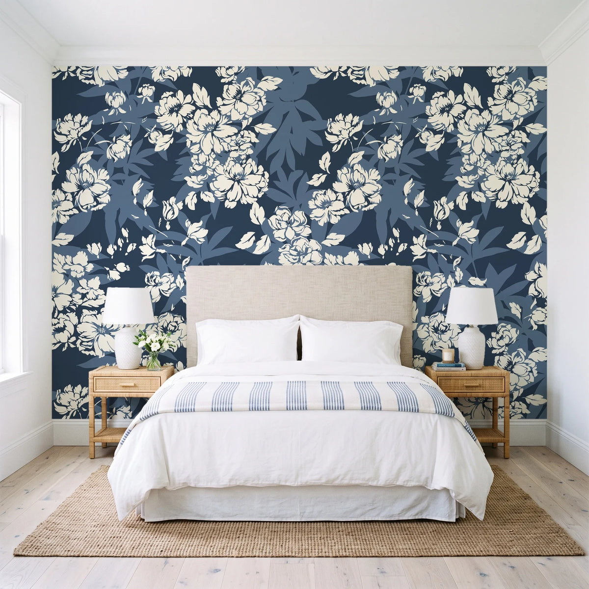 Frost Garden Veil Slate floral wallpaper behind a queen bed in a bright coastal bedroom