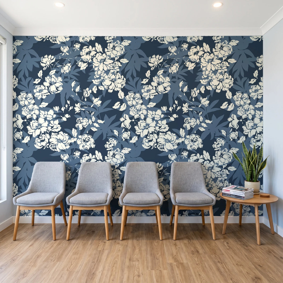 Frost Garden Veil Slate floral wallpaper behind a row of upholstered chairs in a bright clinic waiting room