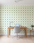 Frost Mosaic Emerald geometric tile wallpaper behind a modern oak desk in a bright home office