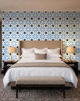 Frost Mosaic Midnight geometric tile wallpaper behind the headboard of a king bed in a contemporary hotel guest room