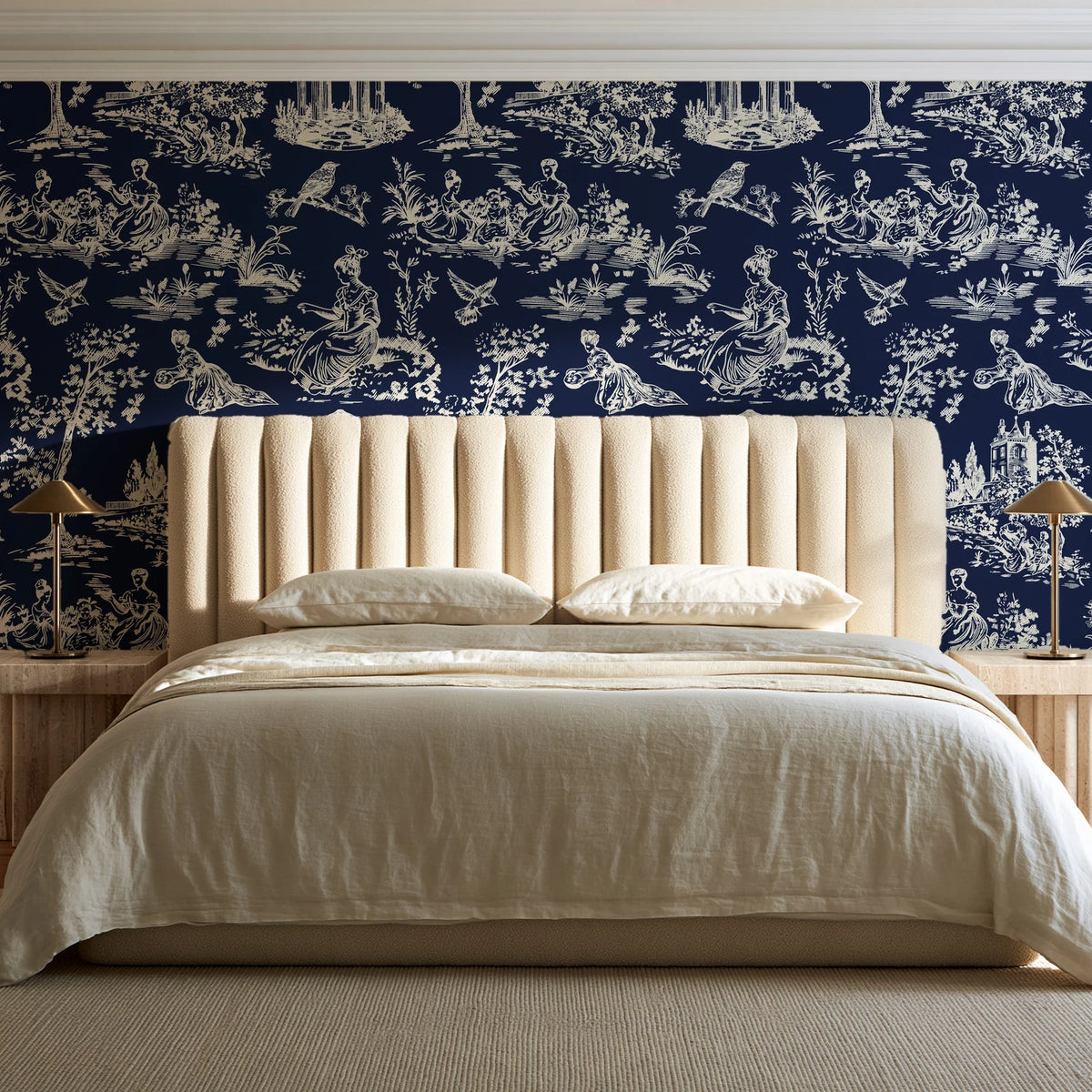 Garden Folly Midnight pastoral toile wallpaper behind a channel-tufted bed in a calm primary bedroom