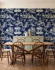 Garden Folly Midnight pastoral toile wallpaper in a farmhouse dining room with a sage sideboard and rustic trestle table
