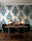 Gentlebotan Ivory botanical damask wallpaper in a dark moody dining room with a candlelit table