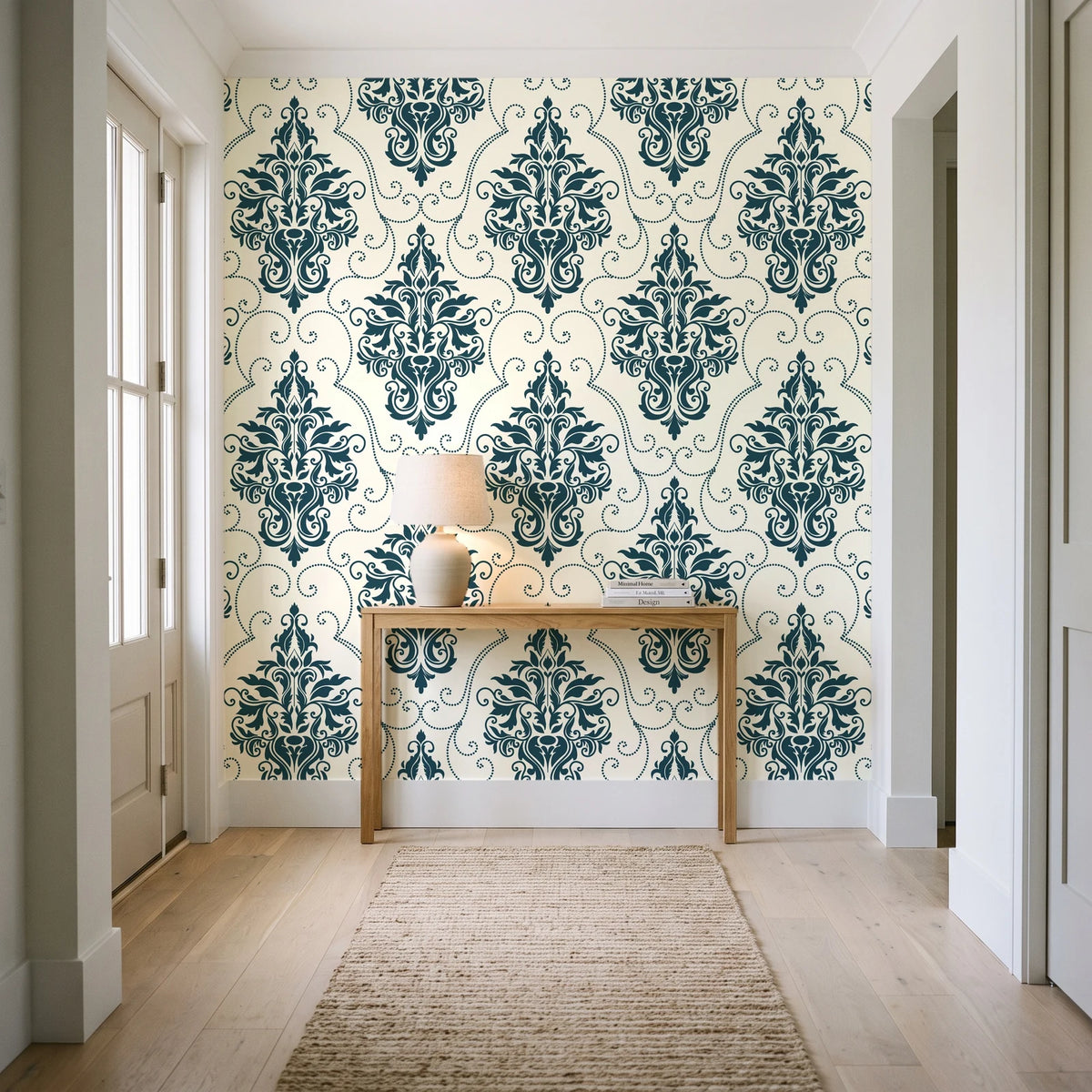 Gentlebotan Ivory botanical damask wallpaper behind a console table in a light entry hallway