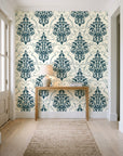 Gentlebotan Ivory botanical damask wallpaper behind a console table in a light entry hallway