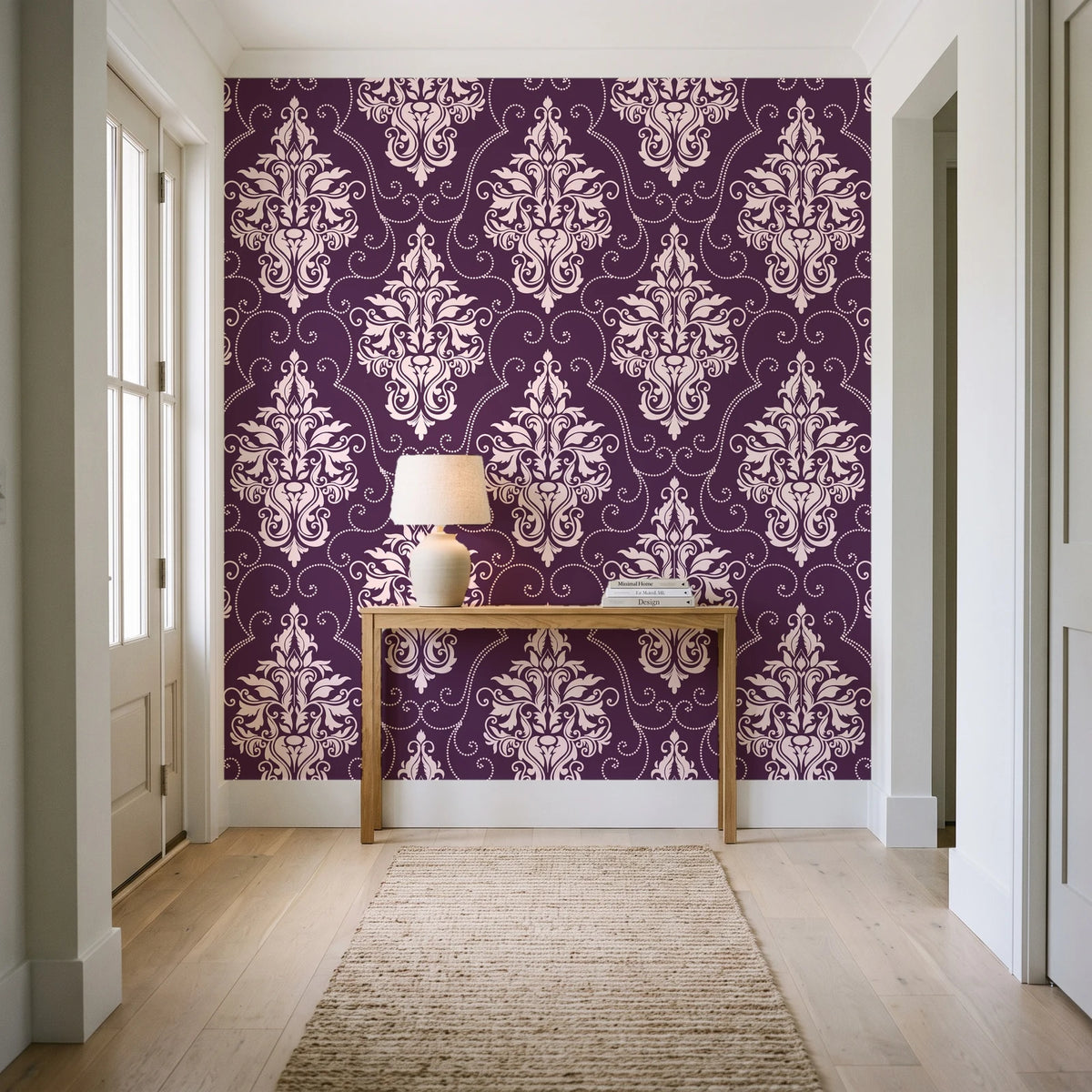 Gentlebotan Plum botanical damask wallpaper behind a console table in a light entry hallway