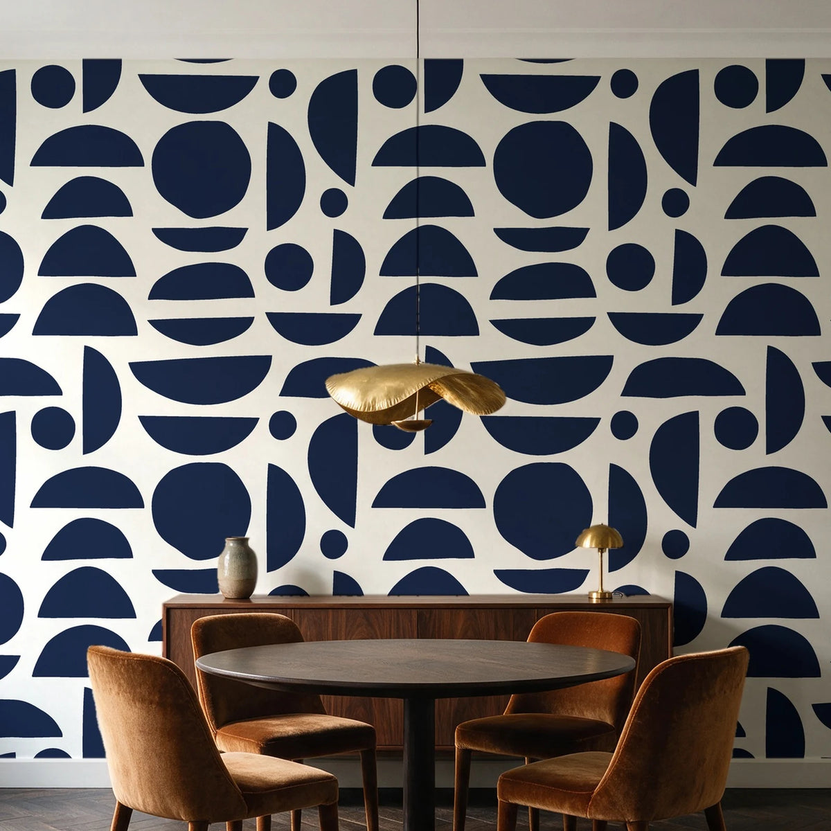Geo Eclipse Midnight organic shapes wallpaper behind a walnut credenza and round table in an elegant dining room