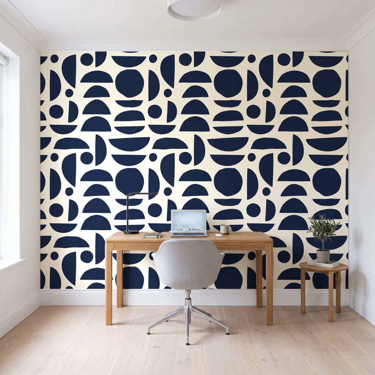 Geo Eclipse Midnight organic shapes wallpaper behind a modern oak desk in a bright home office