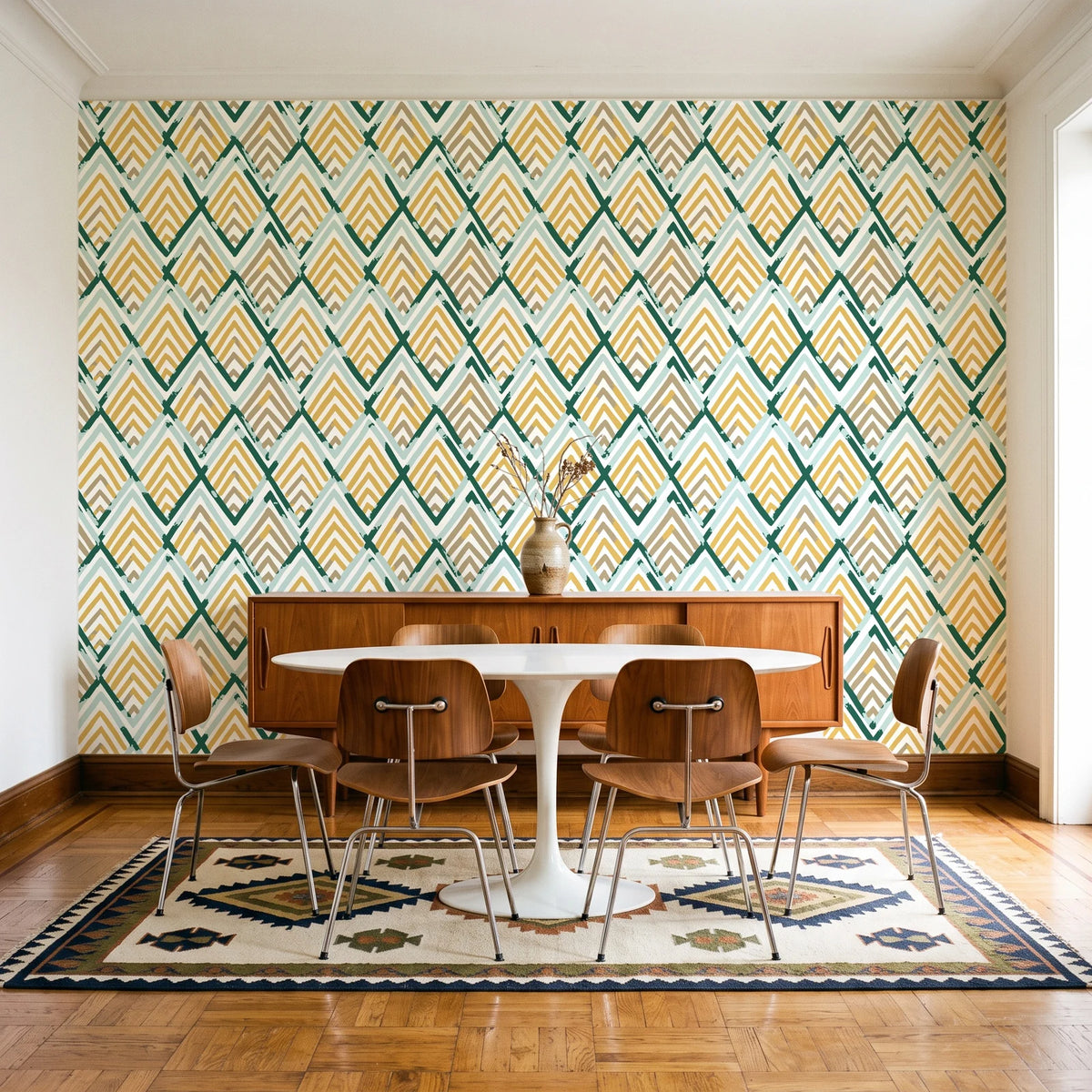Gilded Crossing Emerald chevron geometric wallpaper in a mid-century dining room with a teak sideboard and tulip table