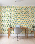 Gilded Crossing Emerald chevron geometric wallpaper behind a modern oak desk in a bright home office