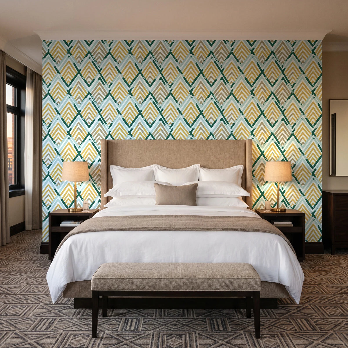 Gilded Crossing Emerald chevron geometric wallpaper behind the headboard of a king bed in a contemporary hotel guest room