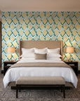 Gilded Crossing Emerald chevron geometric wallpaper behind the headboard of a king bed in a contemporary hotel guest room