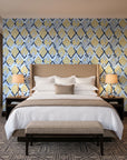 Gilded Crossing Navy chevron geometric wallpaper behind the headboard of a king bed in a contemporary hotel guest room