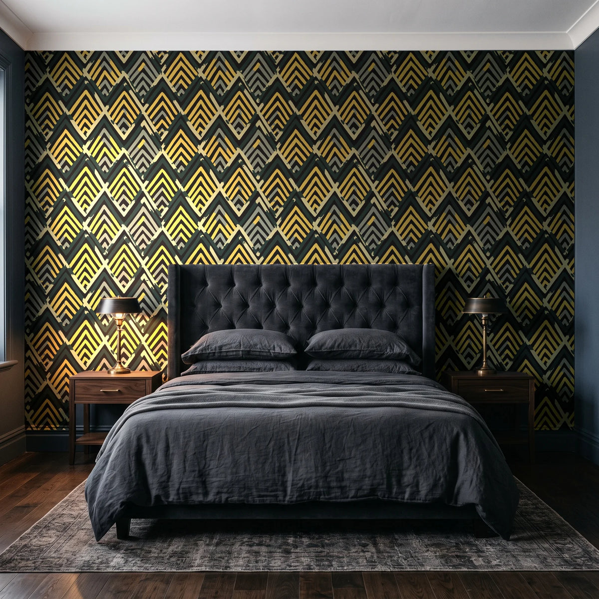 Gilded Crossing Onyx chevron geometric wallpaper behind a tufted headboard in a dark, moody bedroom