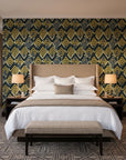 Gilded Crossing Onyx chevron geometric wallpaper behind the headboard of a king bed in a contemporary hotel guest room