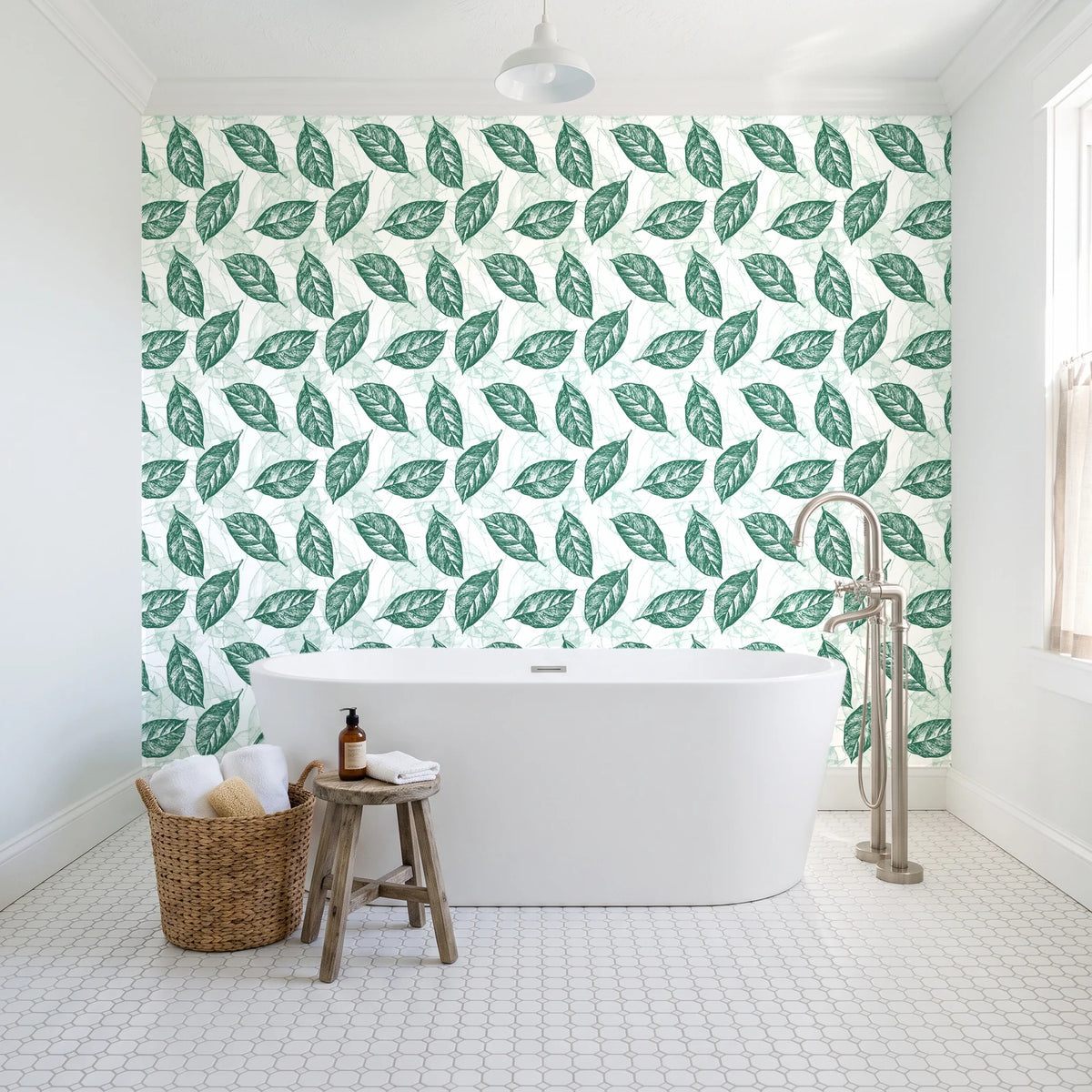 Gilded Frond Emerald leaf wallpaper behind a freestanding tub in a bright coastal bathroom