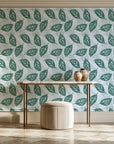 Gilded Frond Emerald leaf wallpaper on the wall of a grand entry foyer