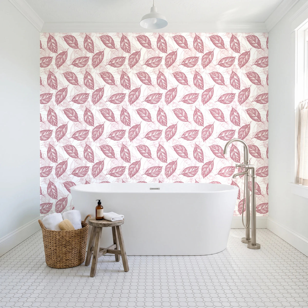 Gilded Frond Rose leaf wallpaper behind a freestanding tub in a bright coastal bathroom