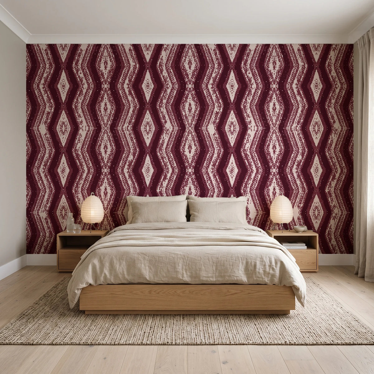 Gilded Rain Oxblood geometric wallpaper behind a low platform bed in a serene Japandi bedroom