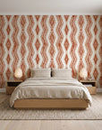 Gilded Rain Terracotta geometric wallpaper behind a low platform bed in a serene Japandi bedroom