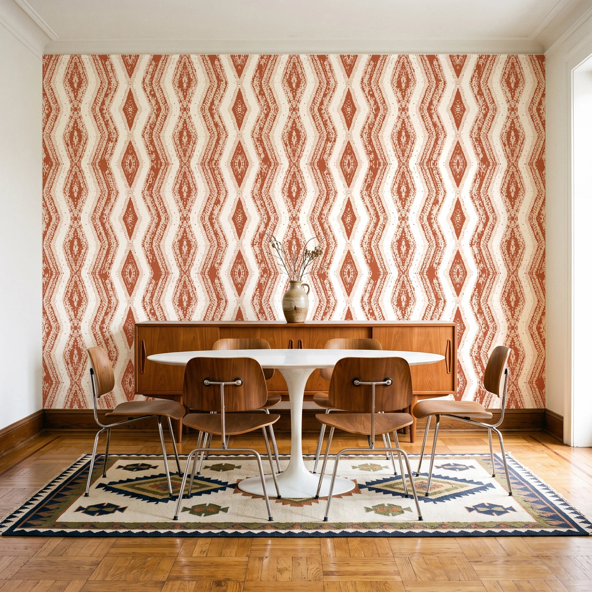 Gilded Rain Terracotta geometric wallpaper in a mid-century dining room with a teak sideboard and tulip table