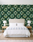 Gilt Scatter Emerald floral scatter wallpaper behind a queen bed in a bright coastal bedroom