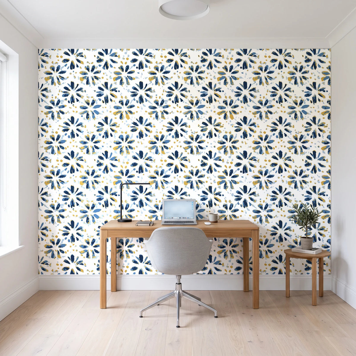 Gilt Scatter Navy floral scatter wallpaper behind a modern oak desk in a bright home office