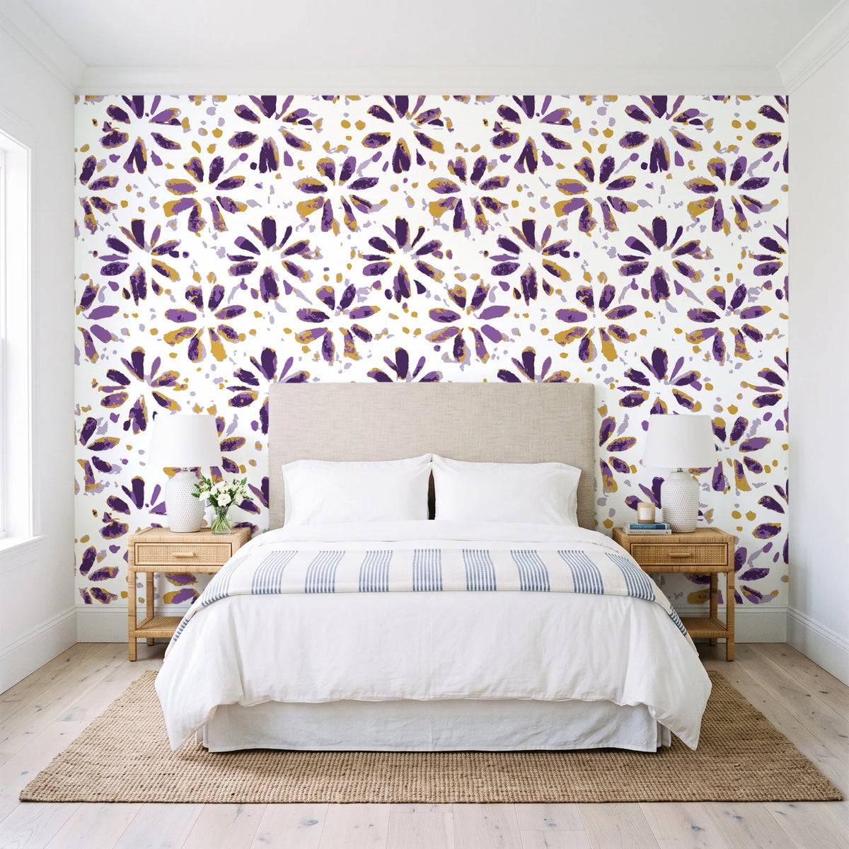 Gilt Scatter Plum floral scatter wallpaper behind a queen bed in a bright coastal bedroom