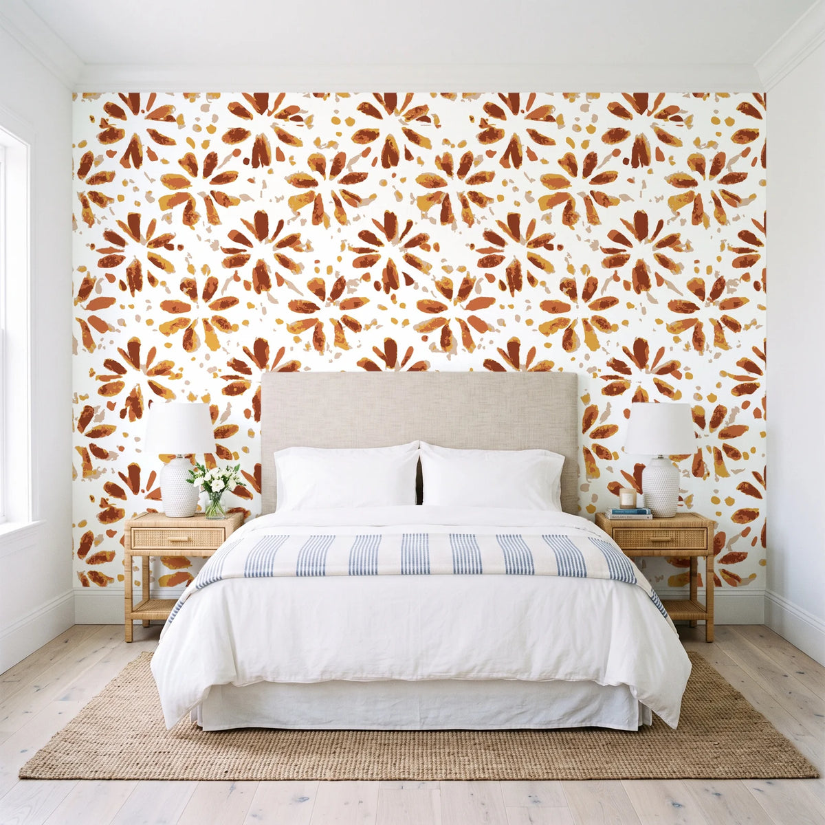 Gilt Scatter Terracotta floral scatter wallpaper behind a queen bed in a bright coastal bedroom
