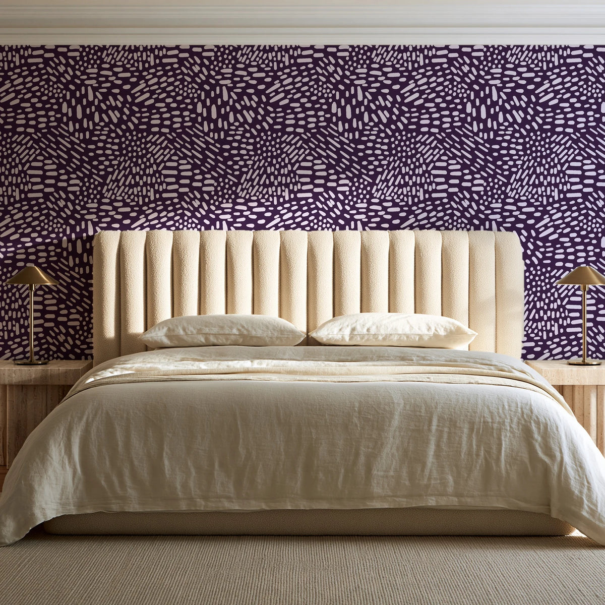 Grain Shift Aubergine minimalist dash wallpaper behind a channel-tufted bed in a calm primary bedroom