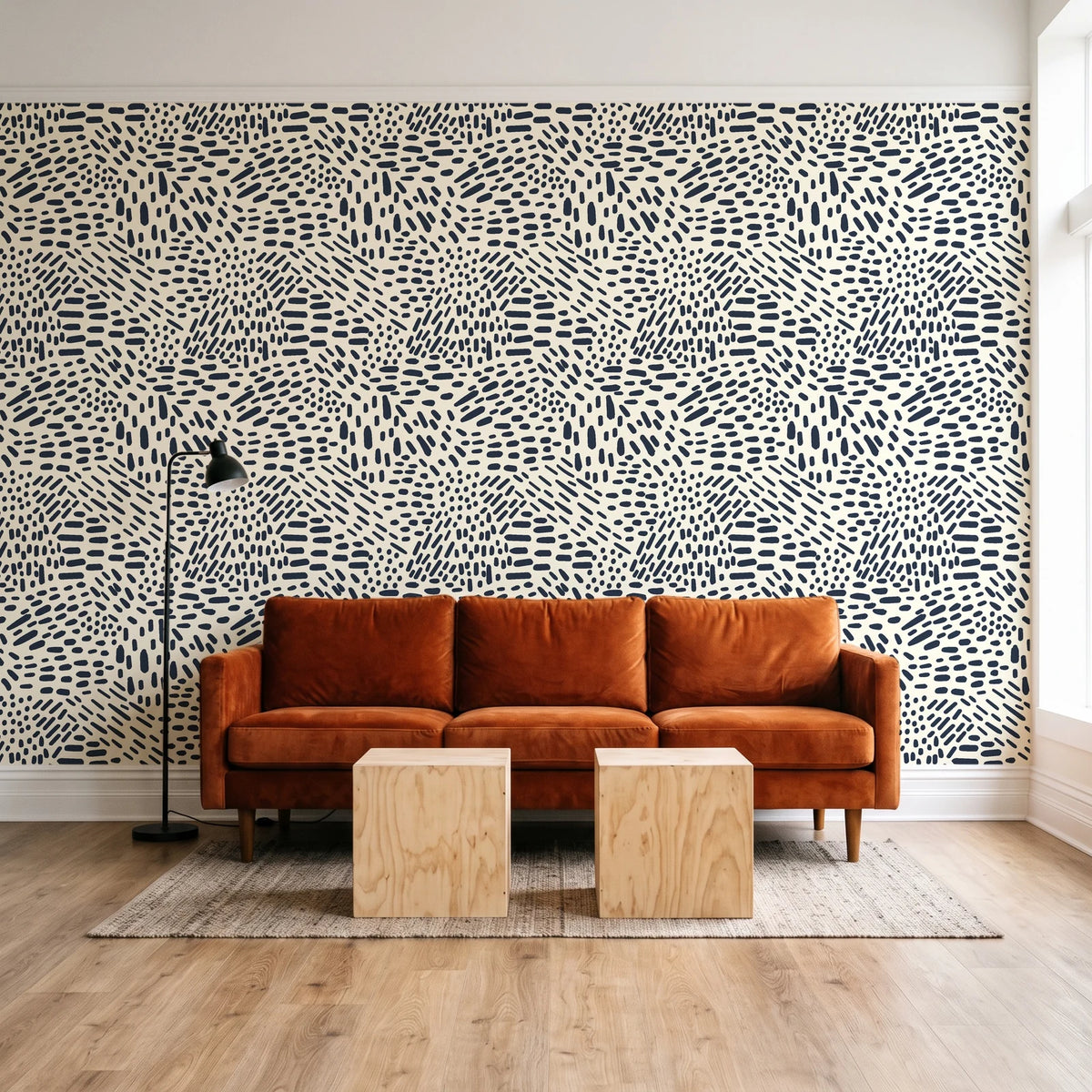 Grain Shift Oatmeal minimalist dash wallpaper behind a rust velvet sofa in a bright coworking lounge