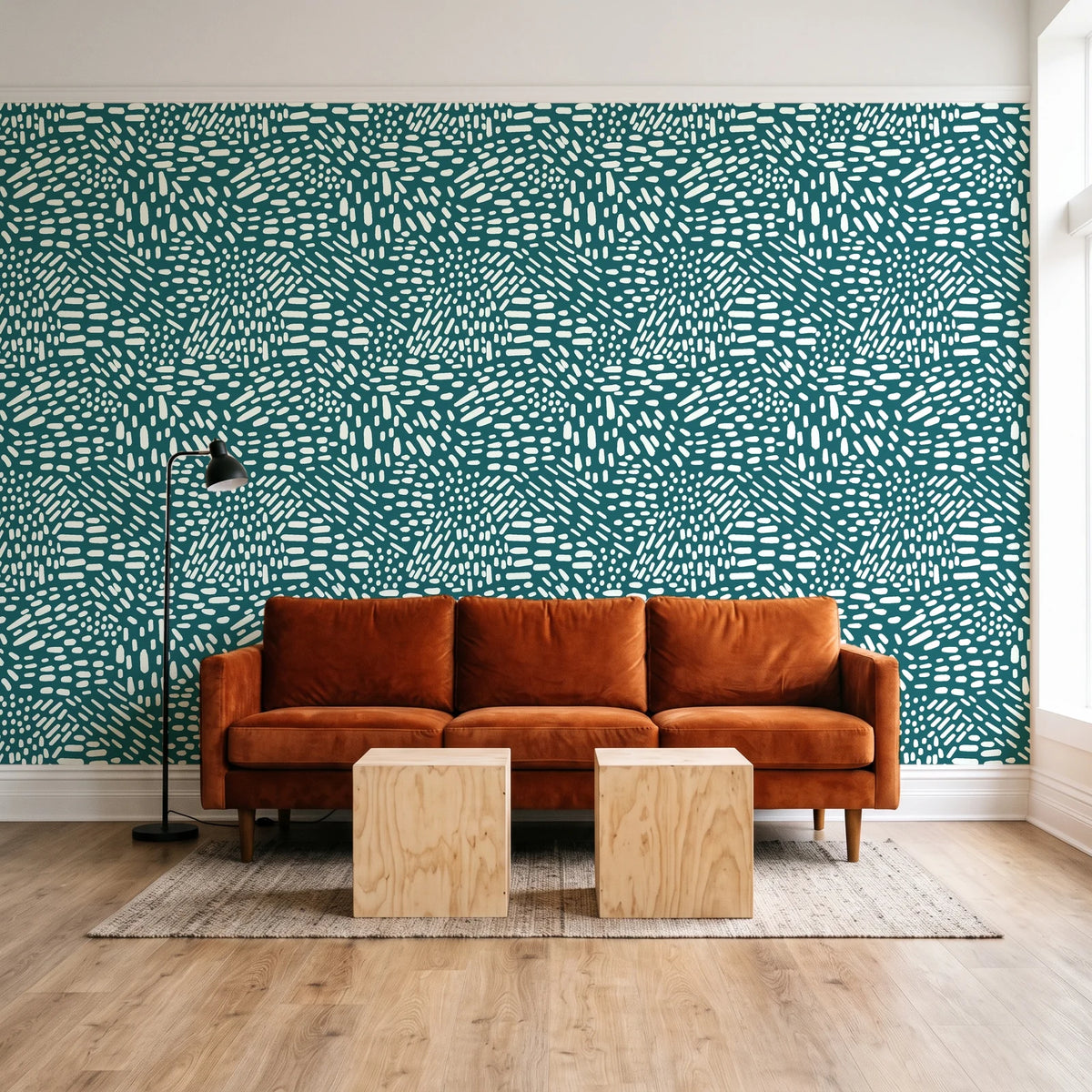 Grain Shift Teal minimalist dash wallpaper behind a rust velvet sofa in a bright coworking lounge