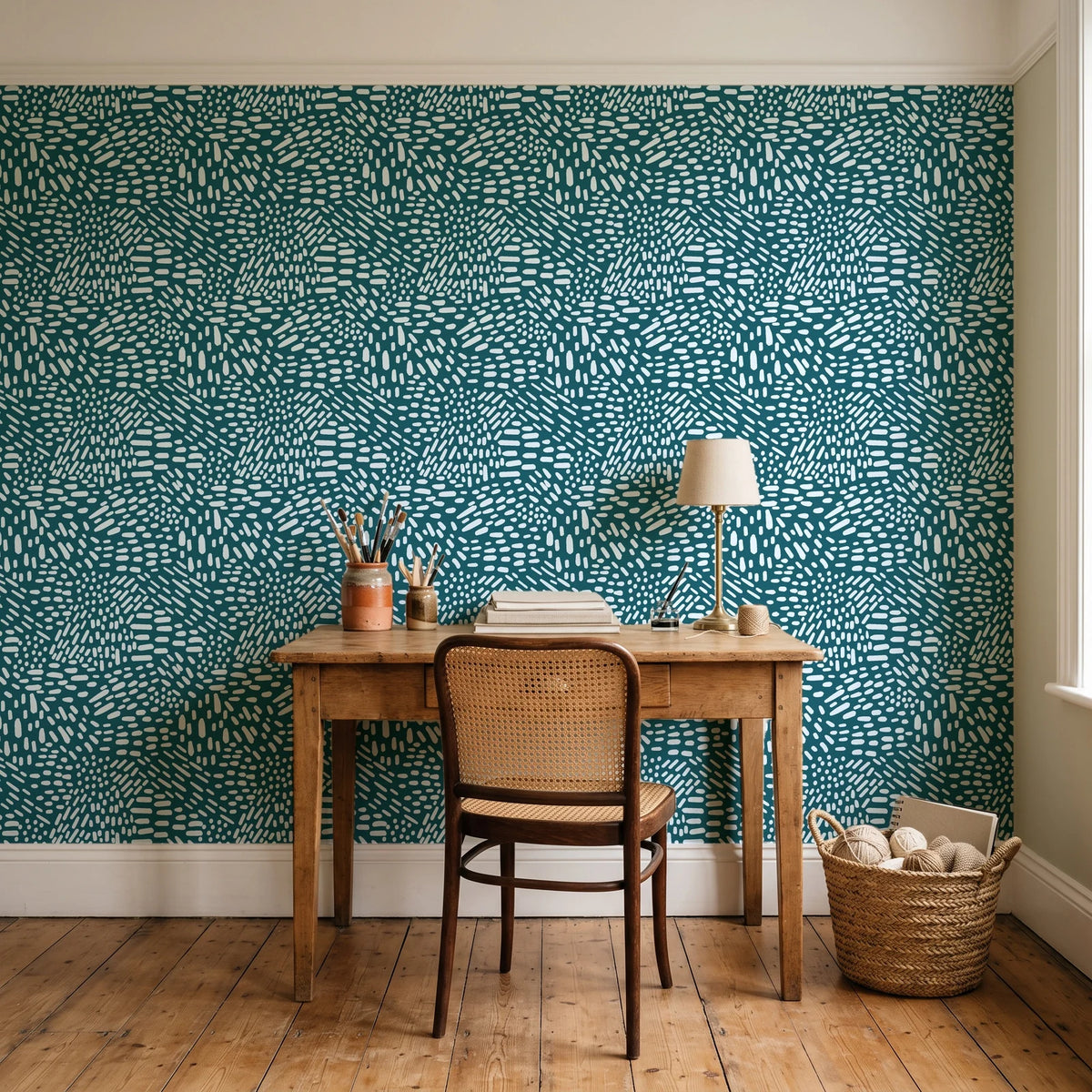 Grain Shift Teal minimalist dash wallpaper behind a vintage writing desk in a cozy craft-room home office
