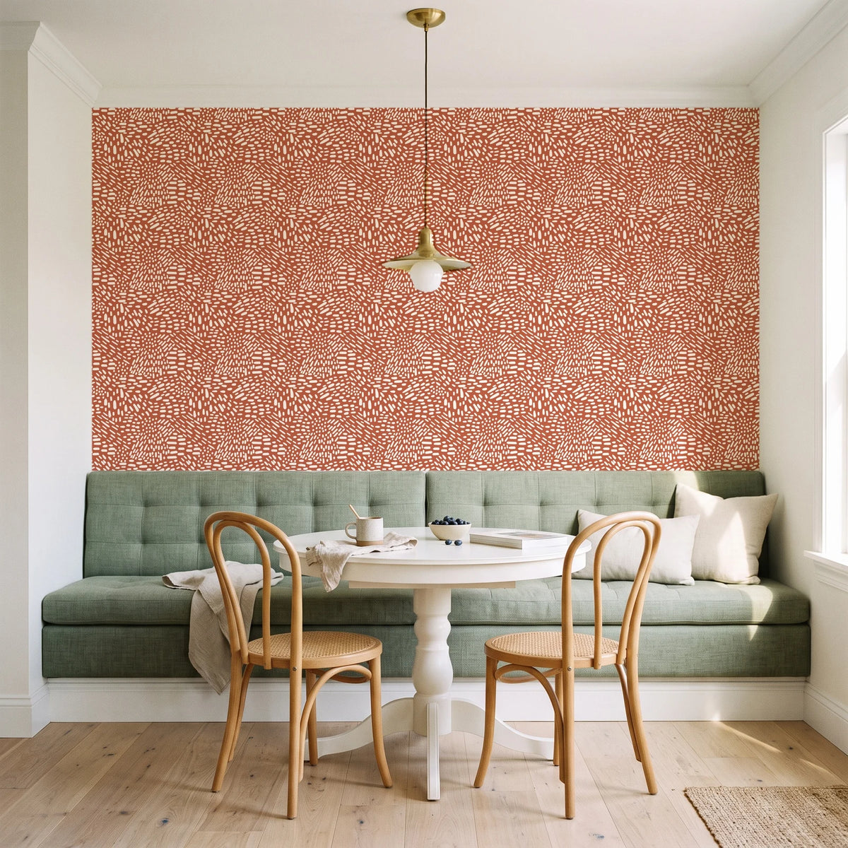 Grain Shift Terracotta minimalist dash wallpaper as a feature wall in a sunlit breakfast nook