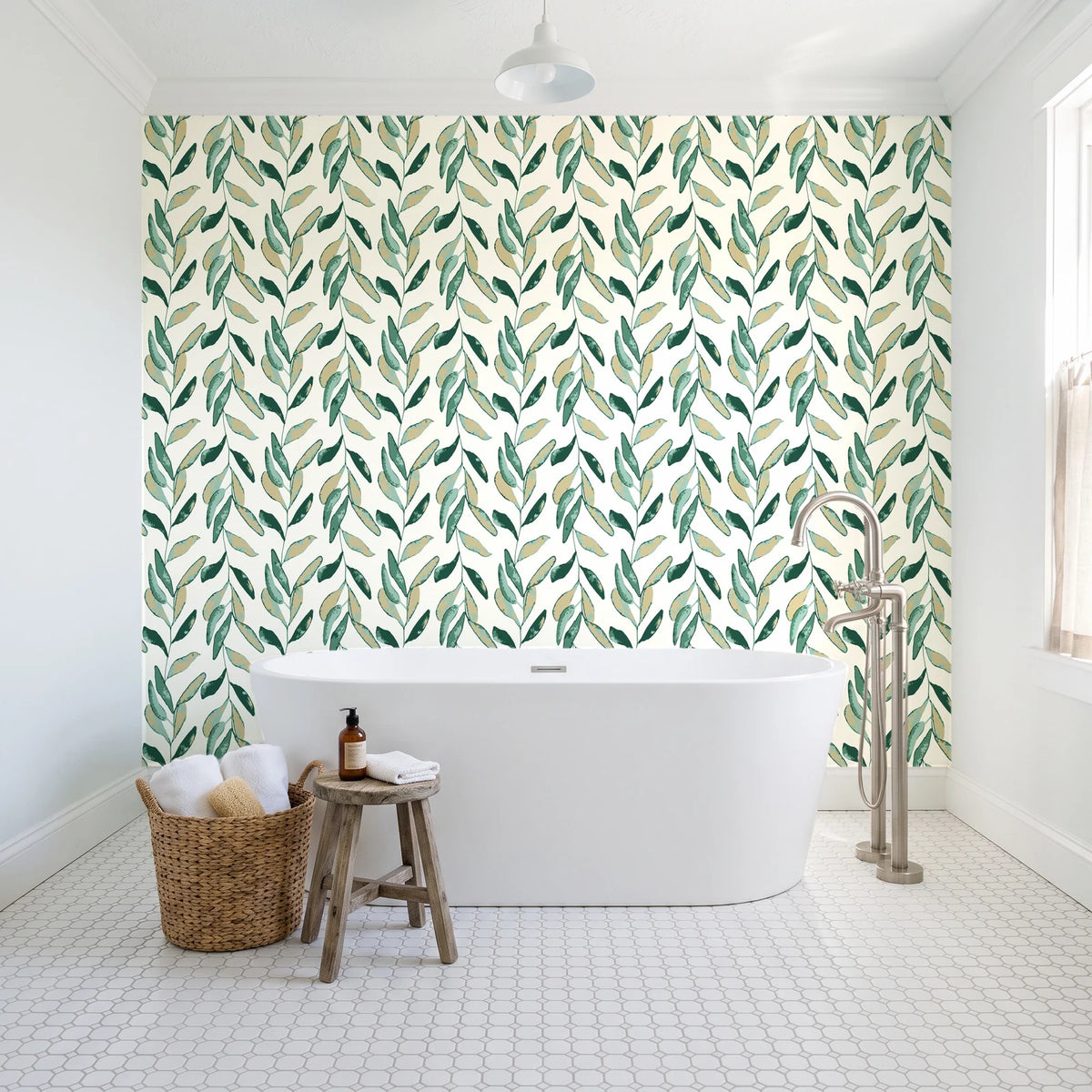 Hanging Garden Emerald botanical wallpaper behind a freestanding tub in a bright coastal bathroom