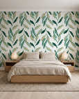 Hanging Garden Emerald botanical wallpaper behind a low platform bed in a serene Japandi bedroom